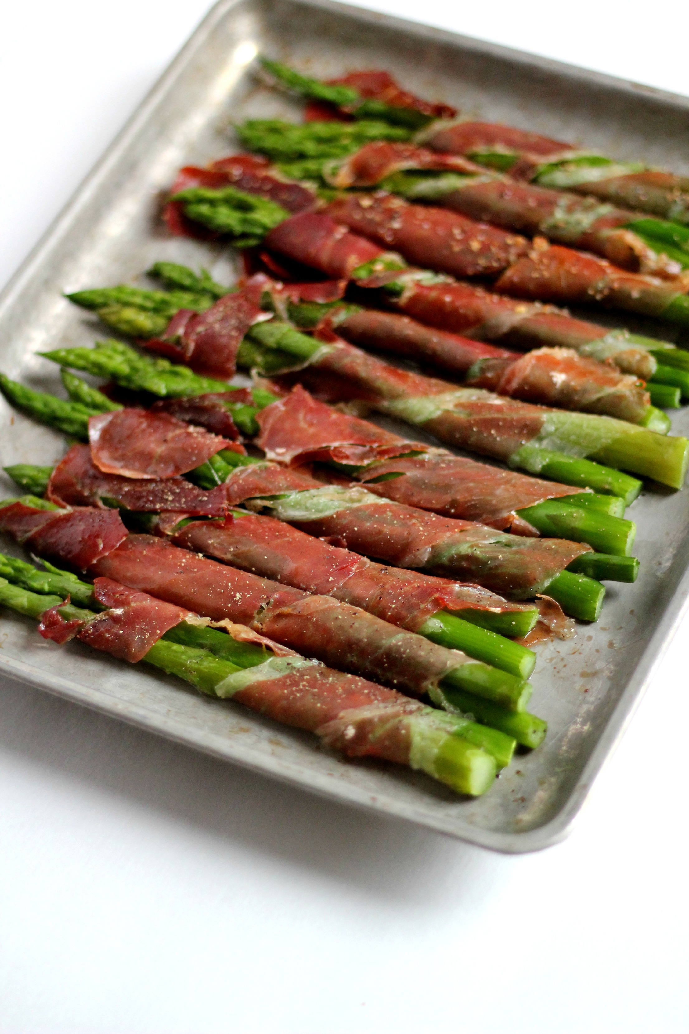 Paleo Prosciutto Wrapped Asparagus are easy to make and an impressive addition to any dinner.